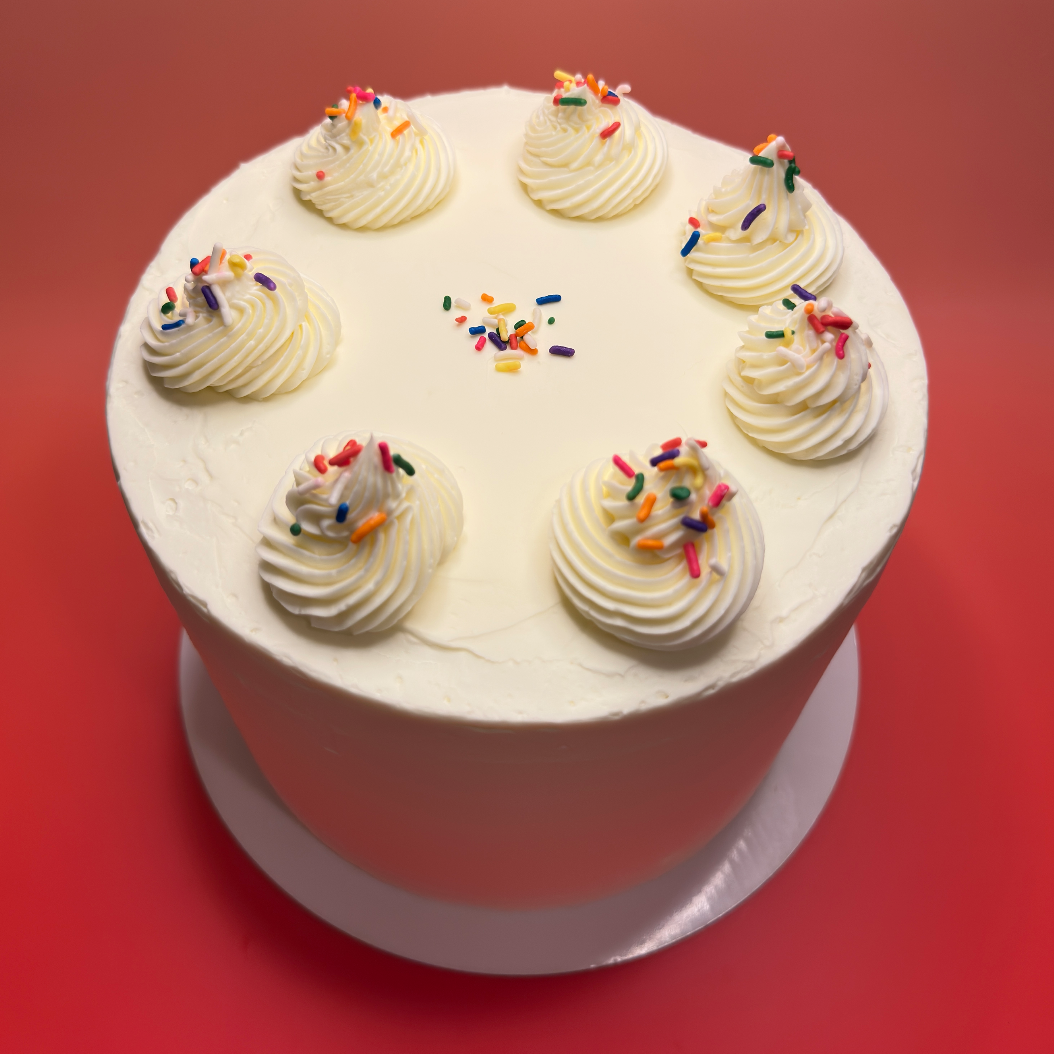 confetti cake, sprinkles, icing, chantilly cream, vanilla spongecake